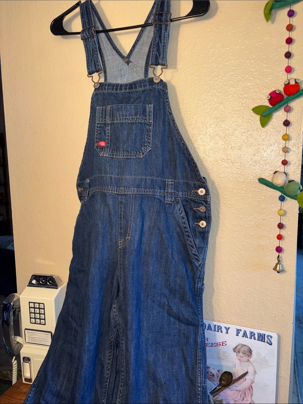EUC Dickies blue denim bib overalls featuring a classic medium wash and a signat